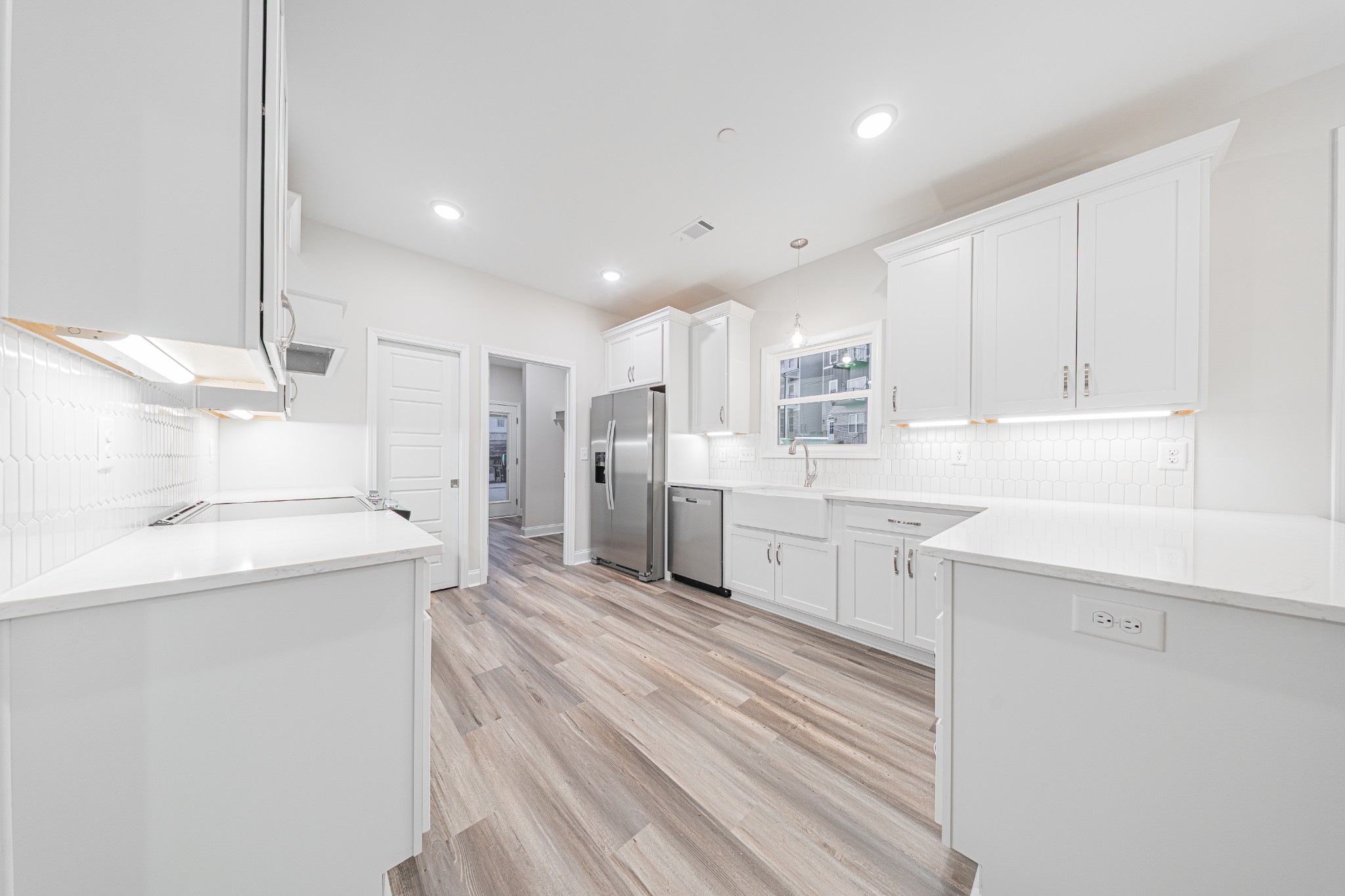 110 Gower Street Pleasant View, TN 37146 - Photo 9 of 32 a large kitchen with a lot of counter space and wooden floor