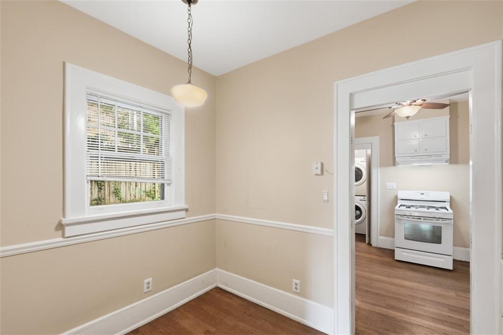 1424 Emory Road Northeast Atlanta, GA 30306 - Photo 13 of 36 a view of an empty room with window and wooden floor