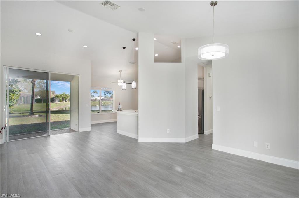 2921 Inlet Cove Lane East Naples, FL 34120 - Photo 13 of 48 a view of a room with wooden floor and window