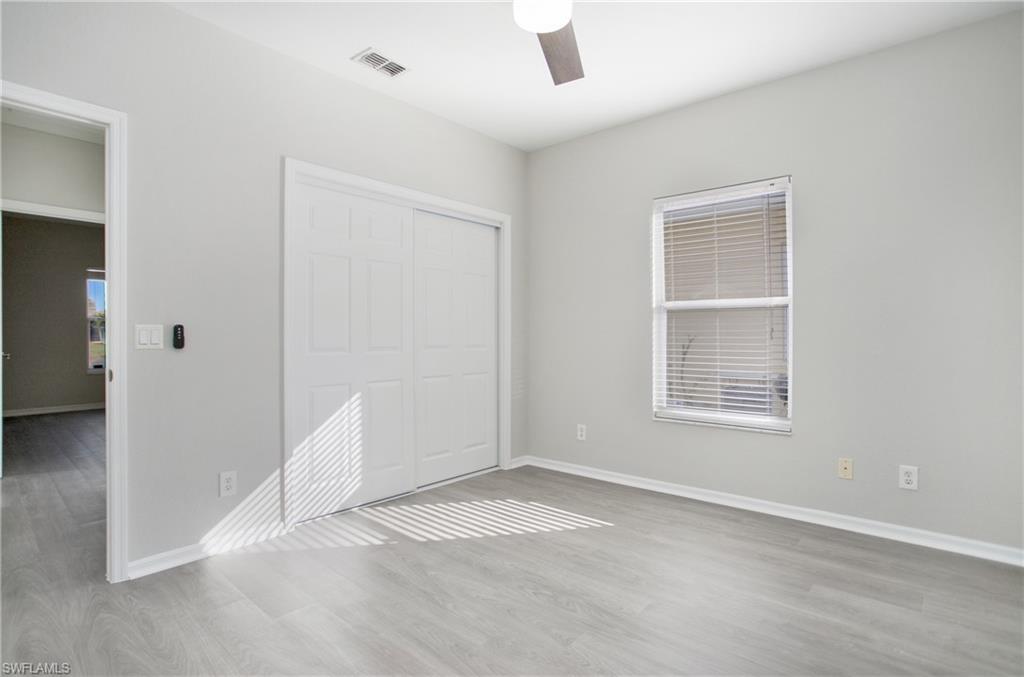 2921 Inlet Cove Lane East Naples, FL 34120 - Photo 22 of 48 an empty room with windows