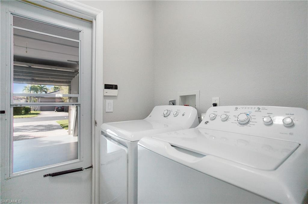 2921 Inlet Cove Lane East Naples, FL 34120 - Photo 28 of 48 a utility room with dryer and washer