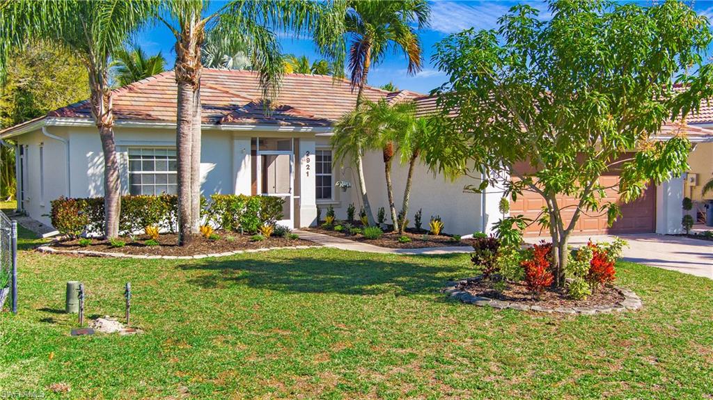 2921 Inlet Cove Lane East Naples, FL 34120 - Photo 34 of 48 a view of a house with backyard porch and sitting area