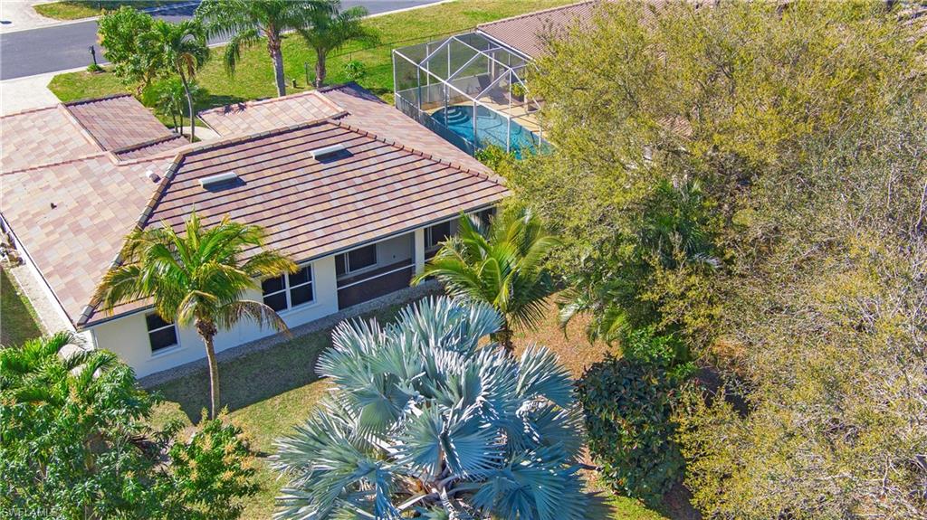 2921 Inlet Cove Lane East Naples, FL 34120 - Photo 39 of 48 a view of house with a yard and potted plants