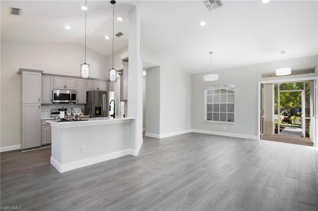 2921 Inlet Cove Lane East Naples, FL 34120 - Photo 4 of 48 a view of kitchen with stainless steel appliances refrigerator oven and cabinets