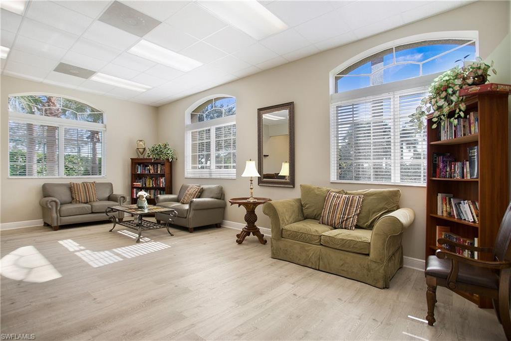2921 Inlet Cove Lane East Naples, FL 34120 - Photo 46 of 48 a living room with furniture and a large window