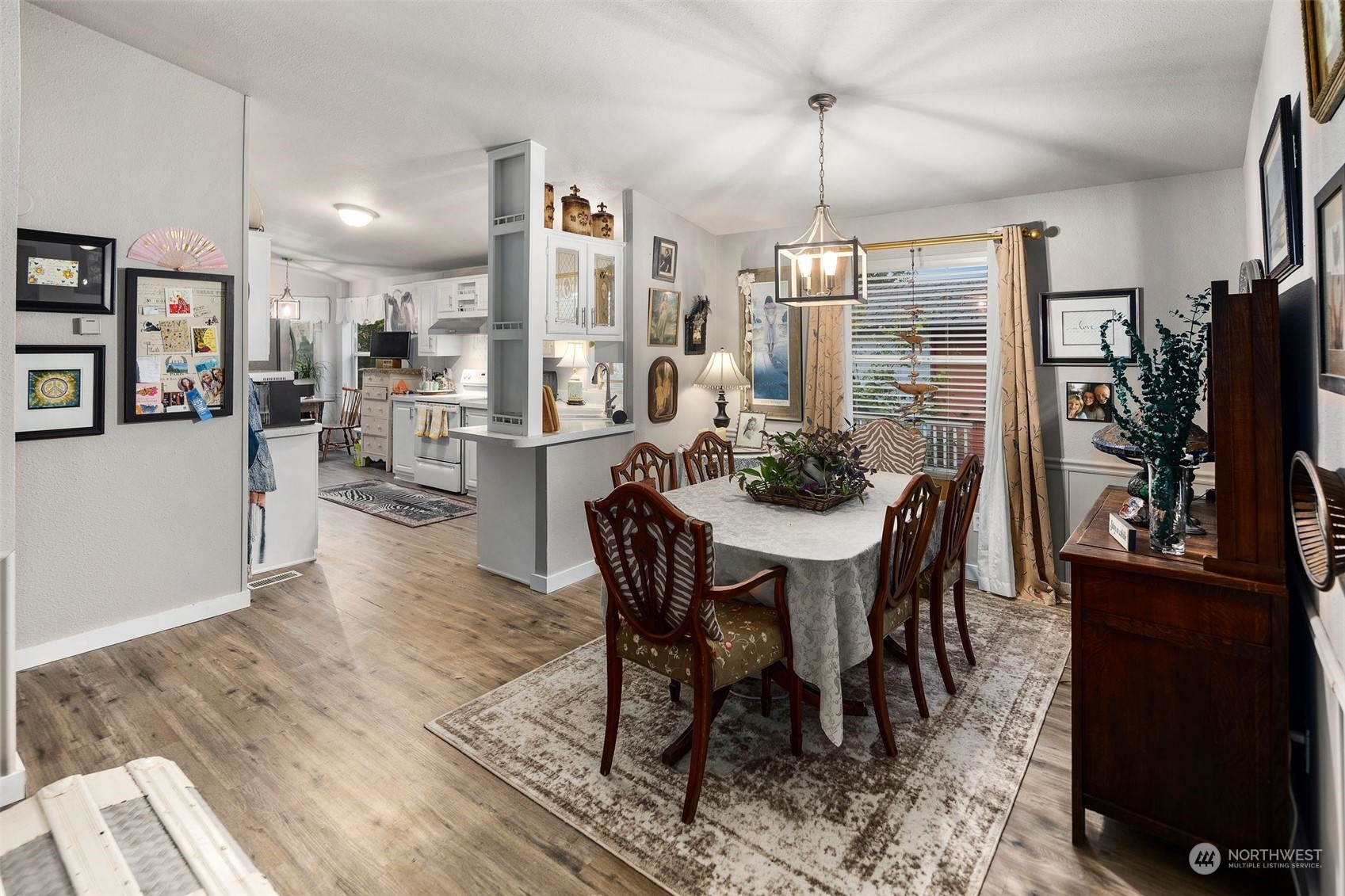 8730 206th Street Southeast, Unit 24 Snohomish, WA 98296 - Photo 15 of 33 a view of a dining room with furniture window and wooden floor