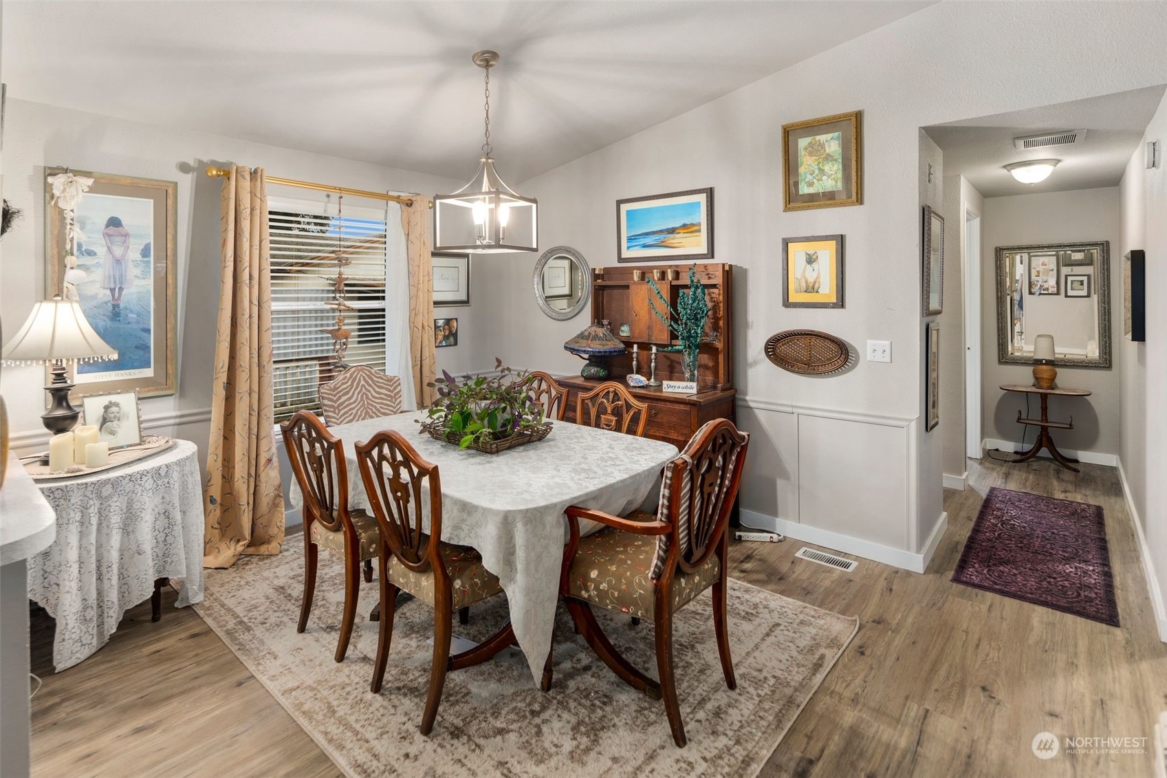 8730 206th Street Southeast, Unit 24 Snohomish, WA 98296 - Photo 16 of 33 a view of a dining room with furniture window and wooden floor