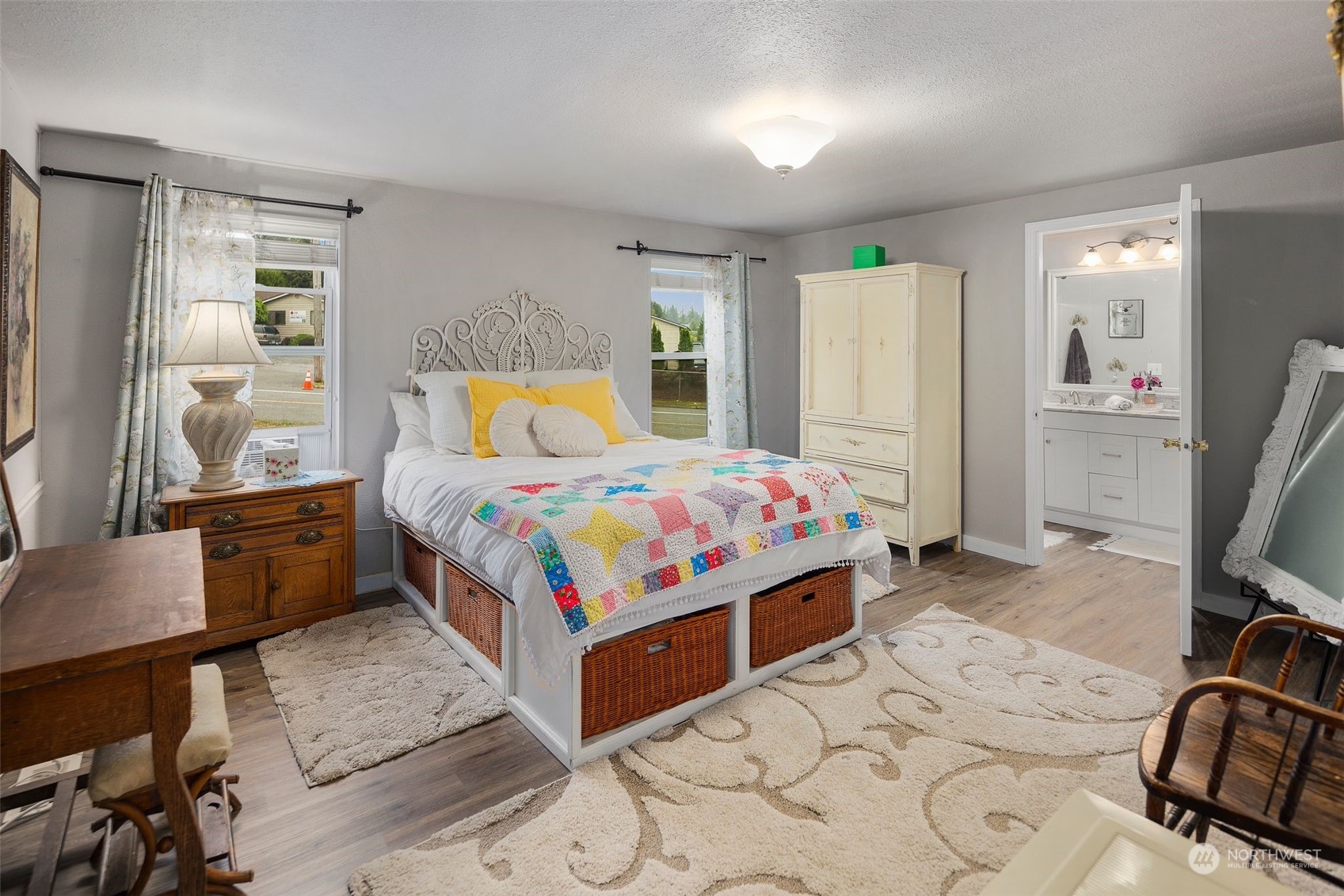 8730 206th Street Southeast, Unit 24 Snohomish, WA 98296 - Photo 17 of 33 a bedroom that has a bed and a table in it