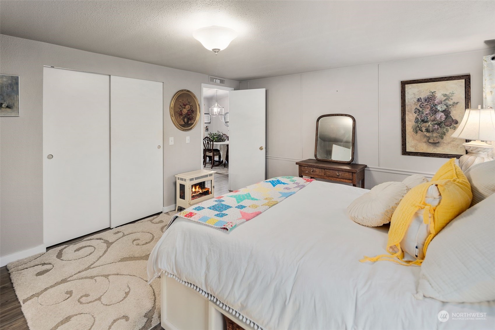 8730 206th Street Southeast, Unit 24 Snohomish, WA 98296 - Photo 20 of 33 a bedroom with a bed and a painting on the wall