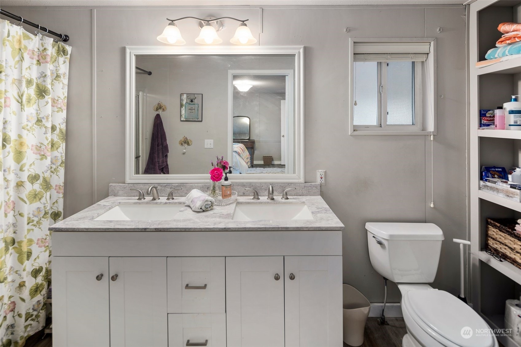 8730 206th Street Southeast, Unit 24 Snohomish, WA 98296 - Photo 21 of 33 a bathroom with a granite countertop toilet sink and mirror