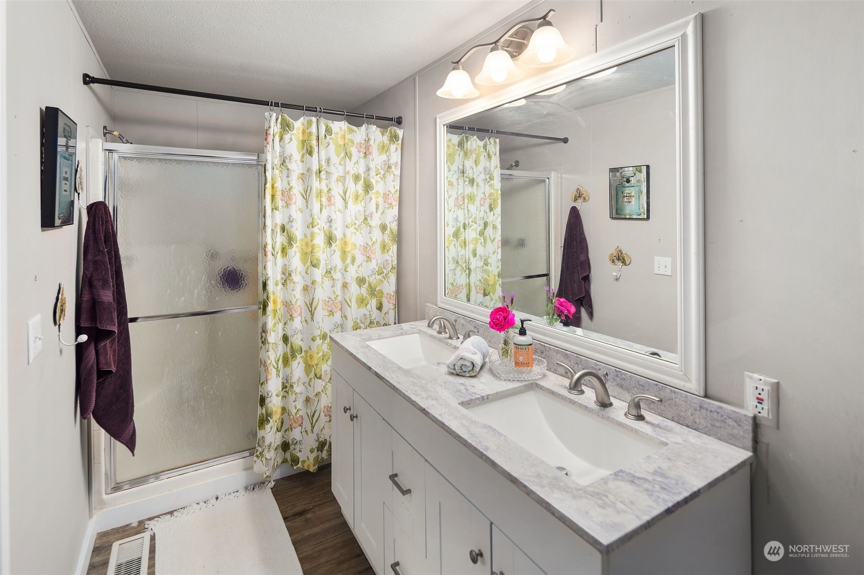 8730 206th Street Southeast, Unit 24 Snohomish, WA 98296 - Photo 22 of 33 a bathroom with a bathtub sink vanity and mirror