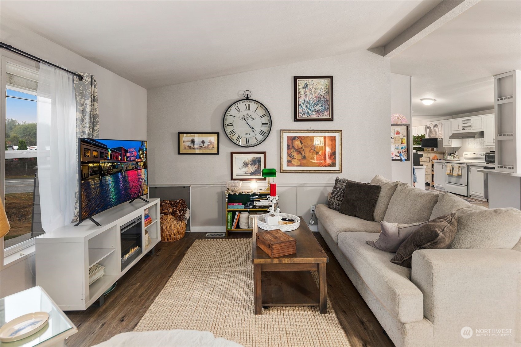 8730 206th Street Southeast, Unit 24 Snohomish, WA 98296 - Photo 7 of 33 a living room with furniture and a flat screen tv