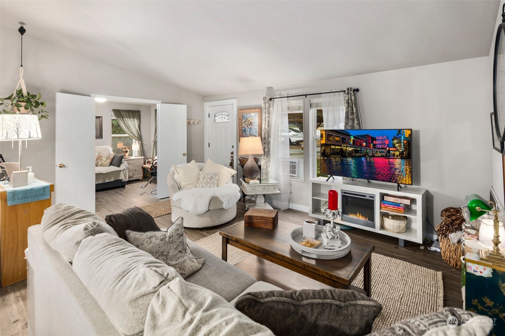 8730 206th Street Southeast, Unit 24 Snohomish, WA 98296 - Photo 8 of 33 a living room with furniture and a flat screen tv