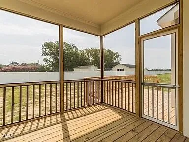 a house view with a garden space and sitting area