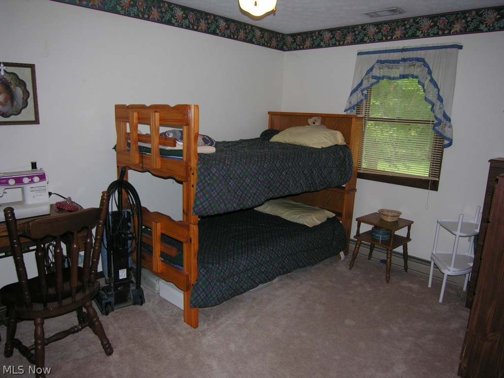 7633 Murray Ridge Road Elyria, OH 44035 - Photo 12 of 21 One of the three bedrooms on the main level.