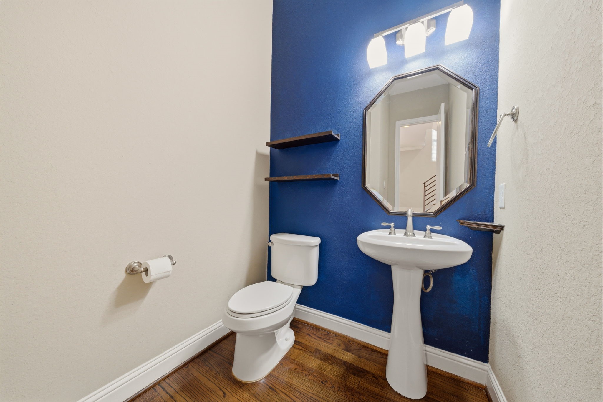 1113 West 18th Street, Unit A Houston, TX 77008 - Photo 18 of 21 a view of a bathroom with a sink and mirror