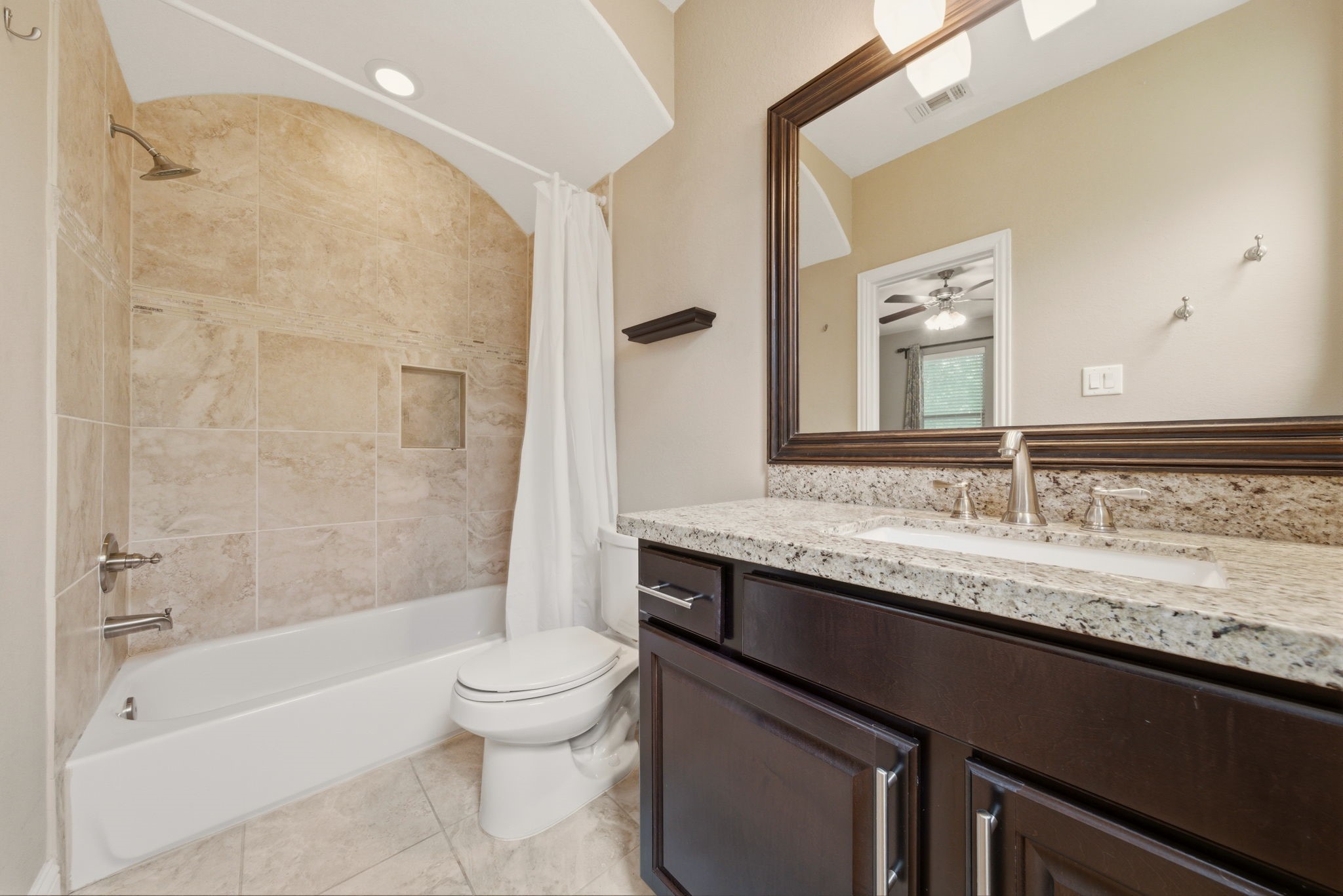 1113 West 18th Street, Unit A Houston, TX 77008 - Photo 19 of 21 a bathroom with a granite countertop bathtub sink vanity mirror and toilet