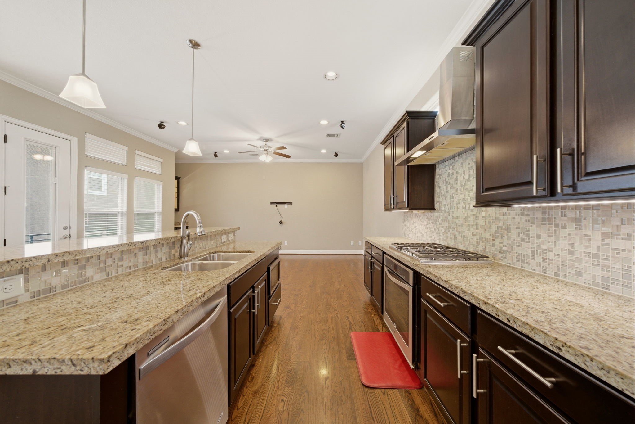 1113 West 18th Street, Unit A Houston, TX 77008 - Photo 8 of 21 a kitchen with granite countertop counter space a sink and stainless steel appliances