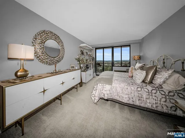 a bedroom with bed and window