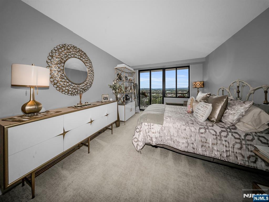 151 Prospect Avenue, Unit 16B Hackensack, NJ 07601 - Photo 11 of 25 a bedroom with bed and window