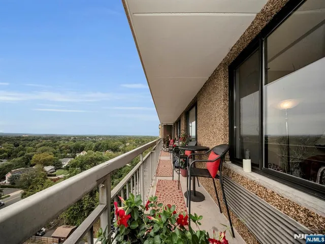 a view of a balcony with furniture