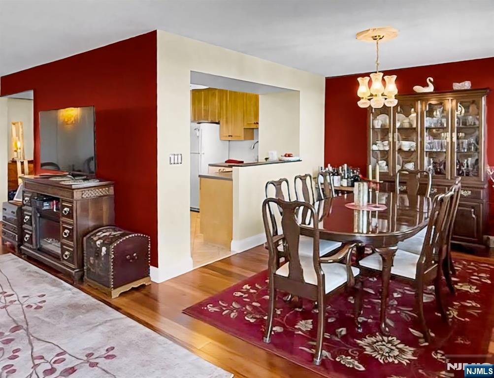 151 Prospect Avenue, Unit 16B Hackensack, NJ 07601 - Photo 8 of 25 a view of a dining room with furniture window and outside view
