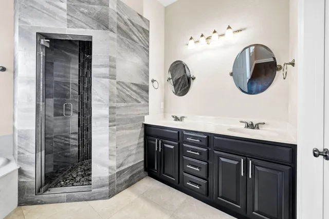 an aerial view of residential houses and street