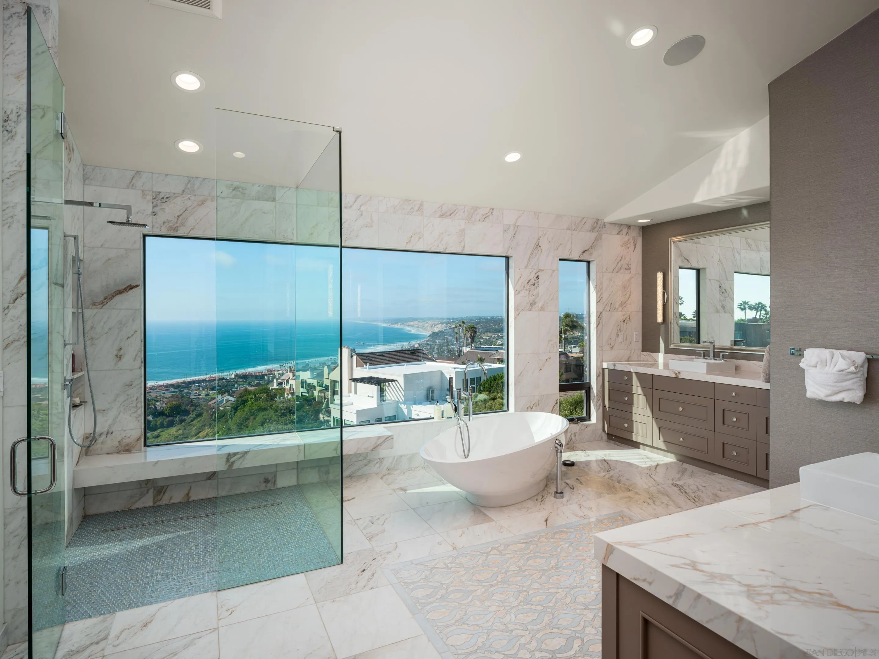 7403 Hillside Drive La Jolla, CA 92037 - Photo 19 of 52 a large bathroom with a large tub and shower