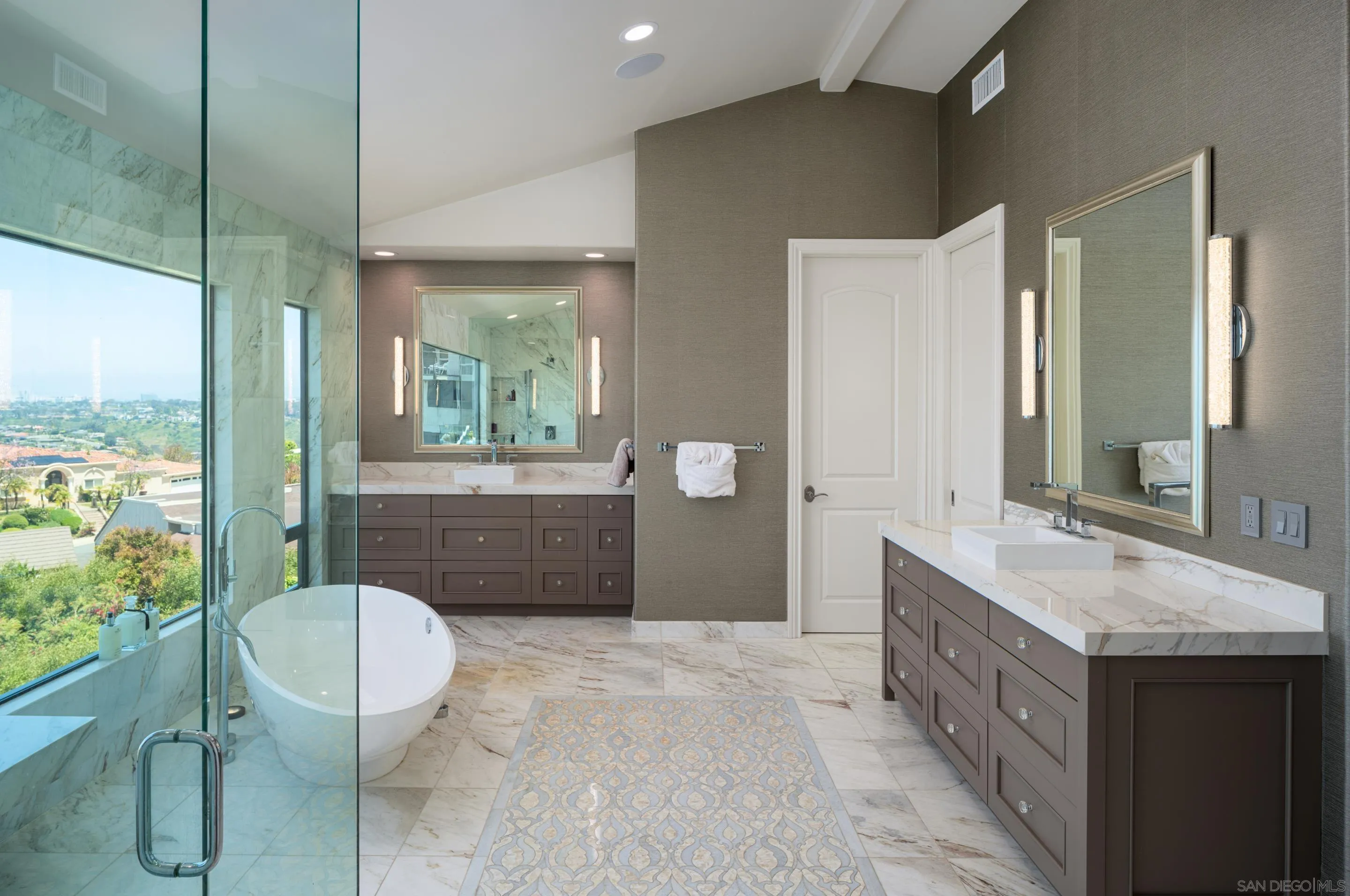 7403 Hillside Drive La Jolla, CA 92037 - Photo 20 of 52 a spacious bathroom with a sink a toilet a mirror and vanity