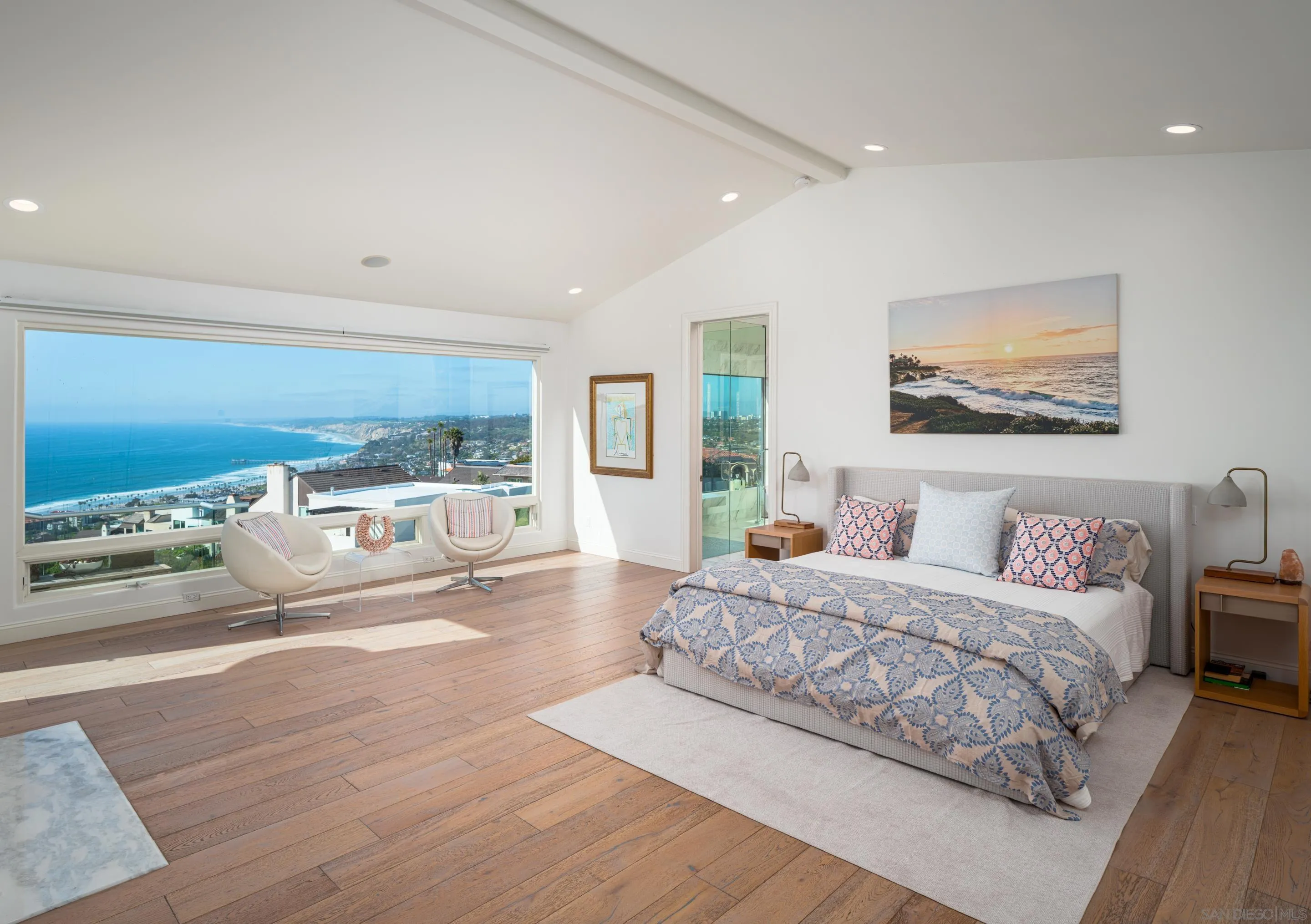 7403 Hillside Drive La Jolla, CA 92037 - Photo 22 of 52 a bedroom with a large bed and a large window