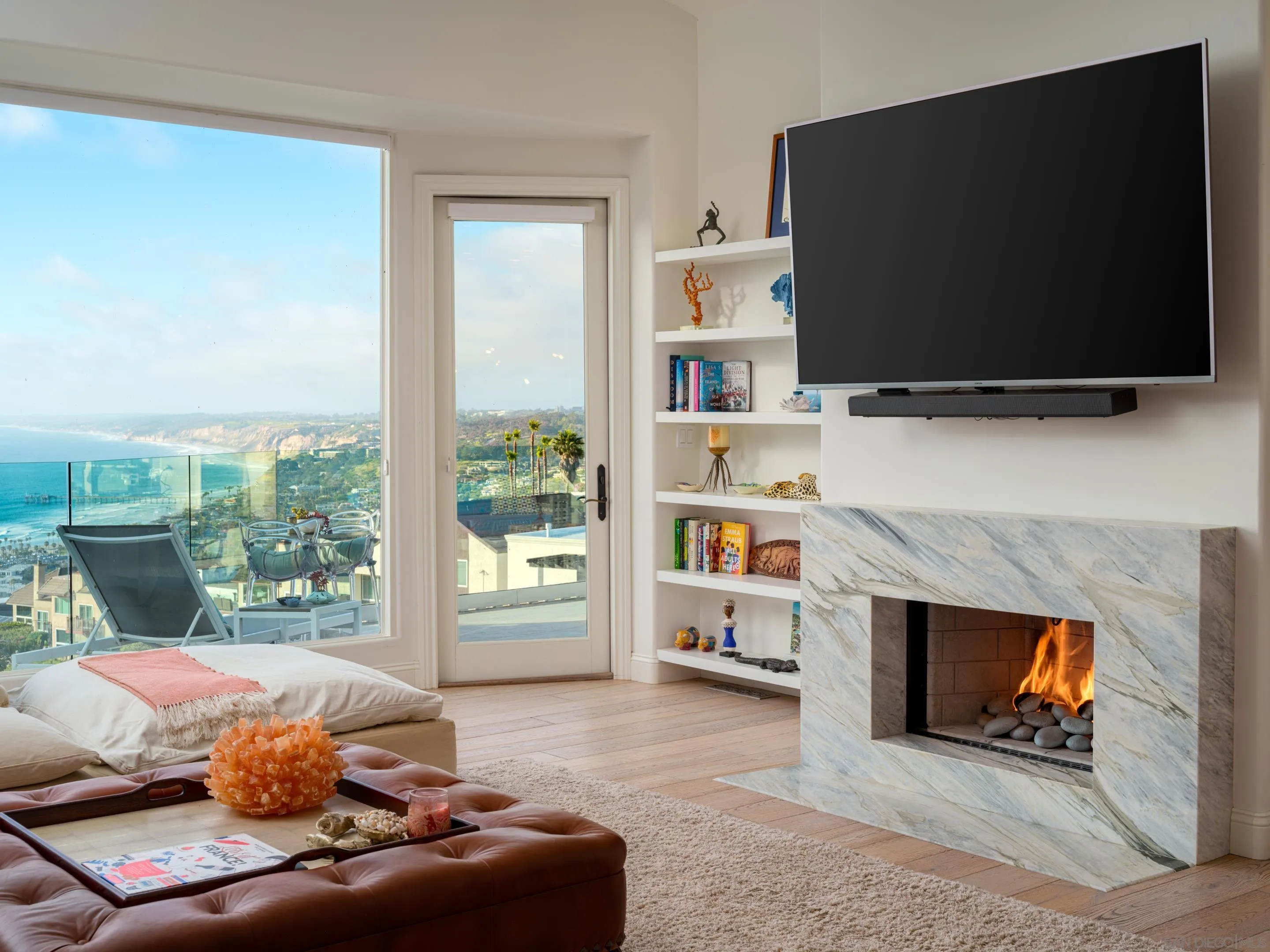 7403 Hillside Drive La Jolla, CA 92037 - Photo 27 of 52 a living room with furniture a flat screen tv and a fireplace