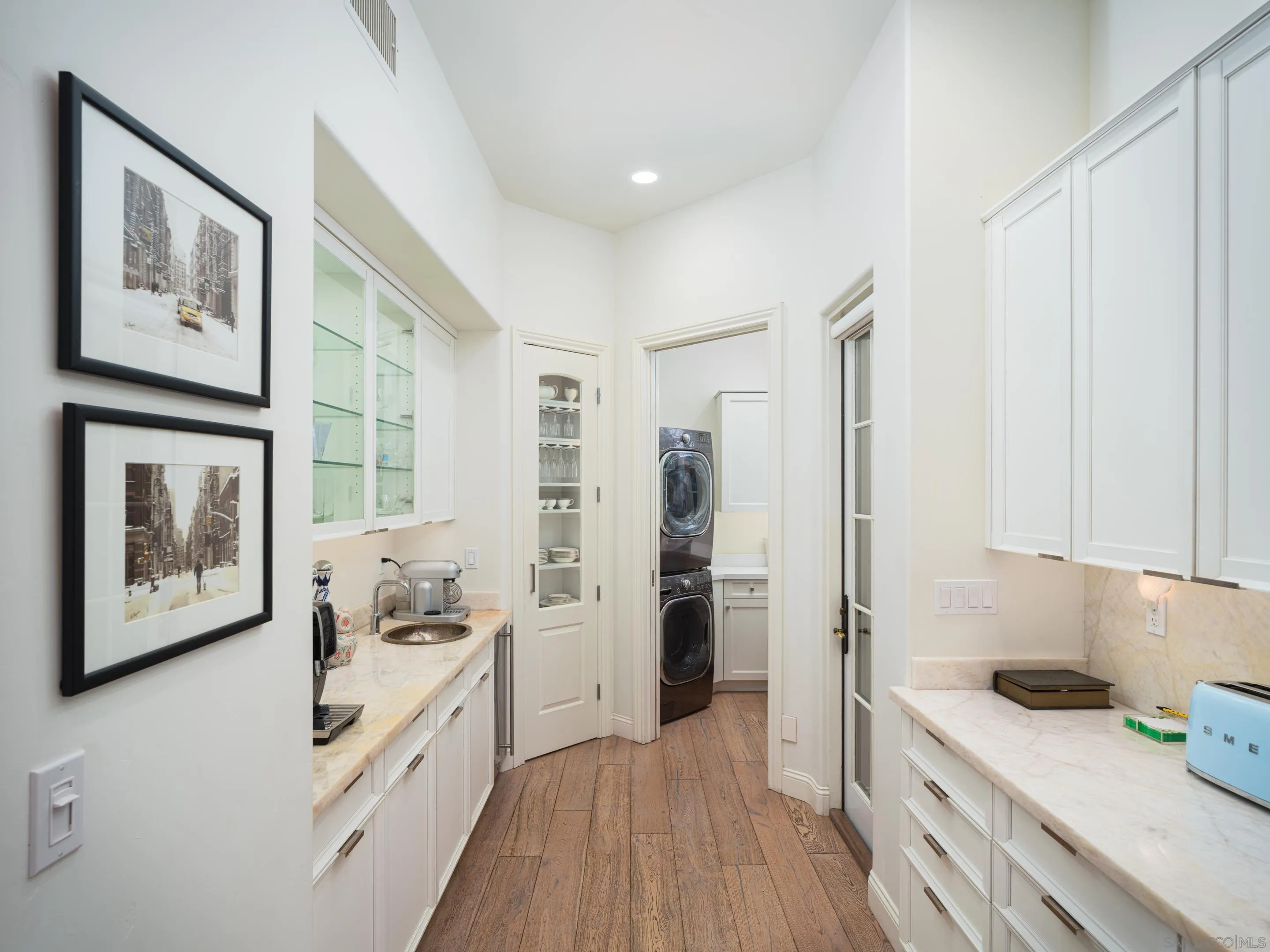 7403 Hillside Drive La Jolla, CA 92037 - Photo 33 of 52 a kitchen with stainless steel appliances a refrigerator and a stove top oven