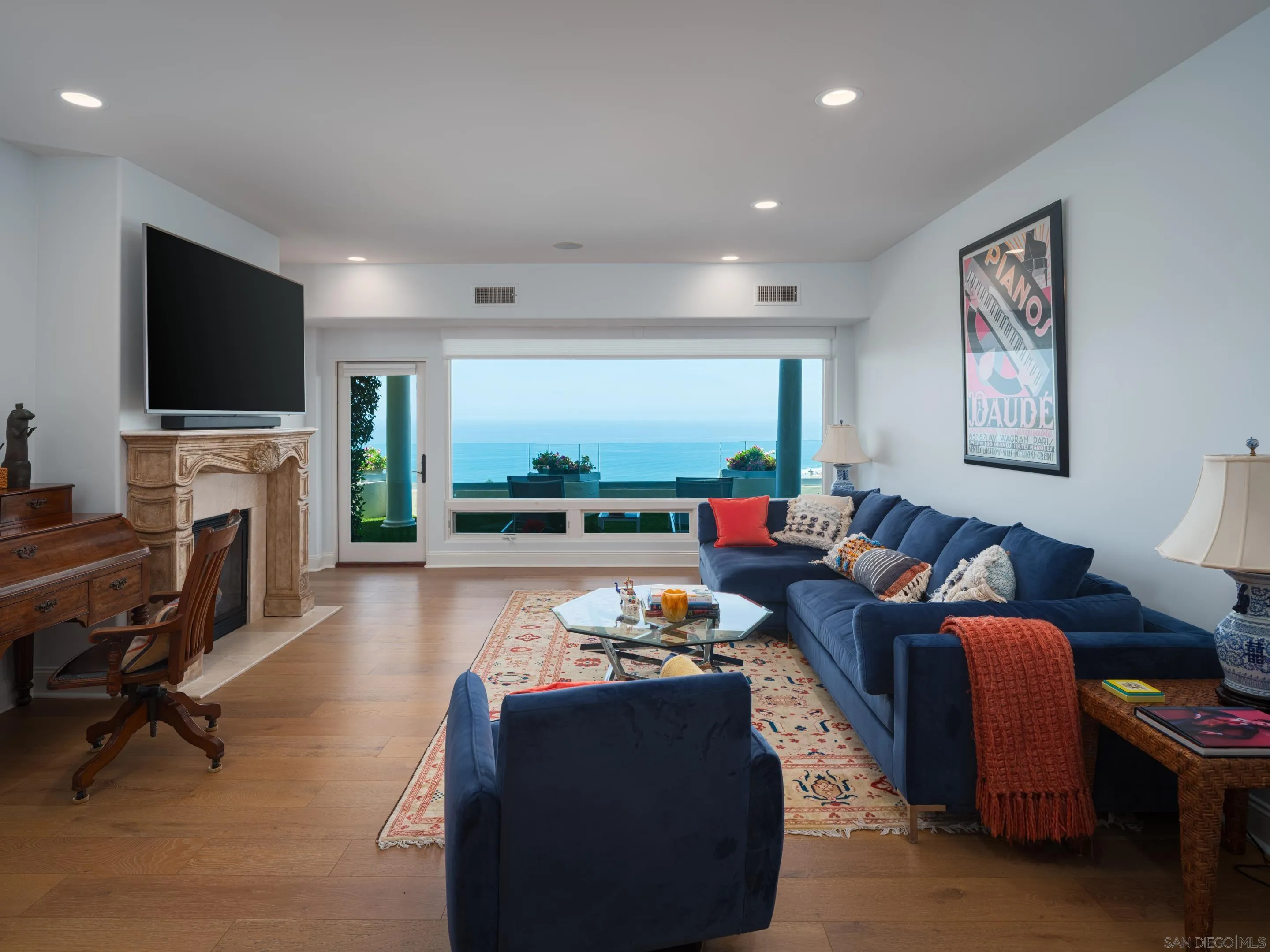 7403 Hillside Drive La Jolla, CA 92037 - Photo 34 of 52 a living room with fireplace furniture and a flat screen tv