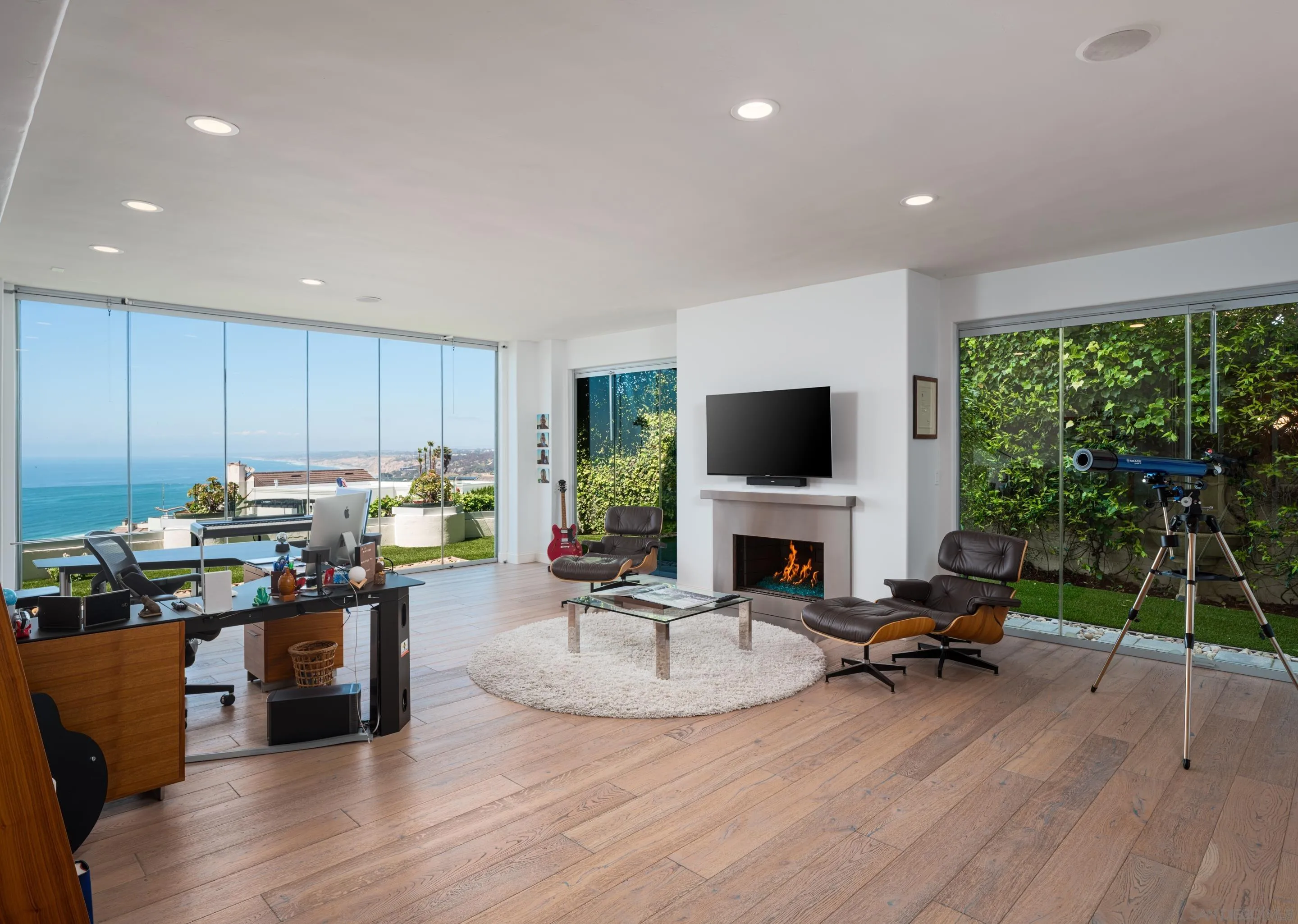 7403 Hillside Drive La Jolla, CA 92037 - Photo 40 of 52 a living room with fireplace furniture and a flat screen tv