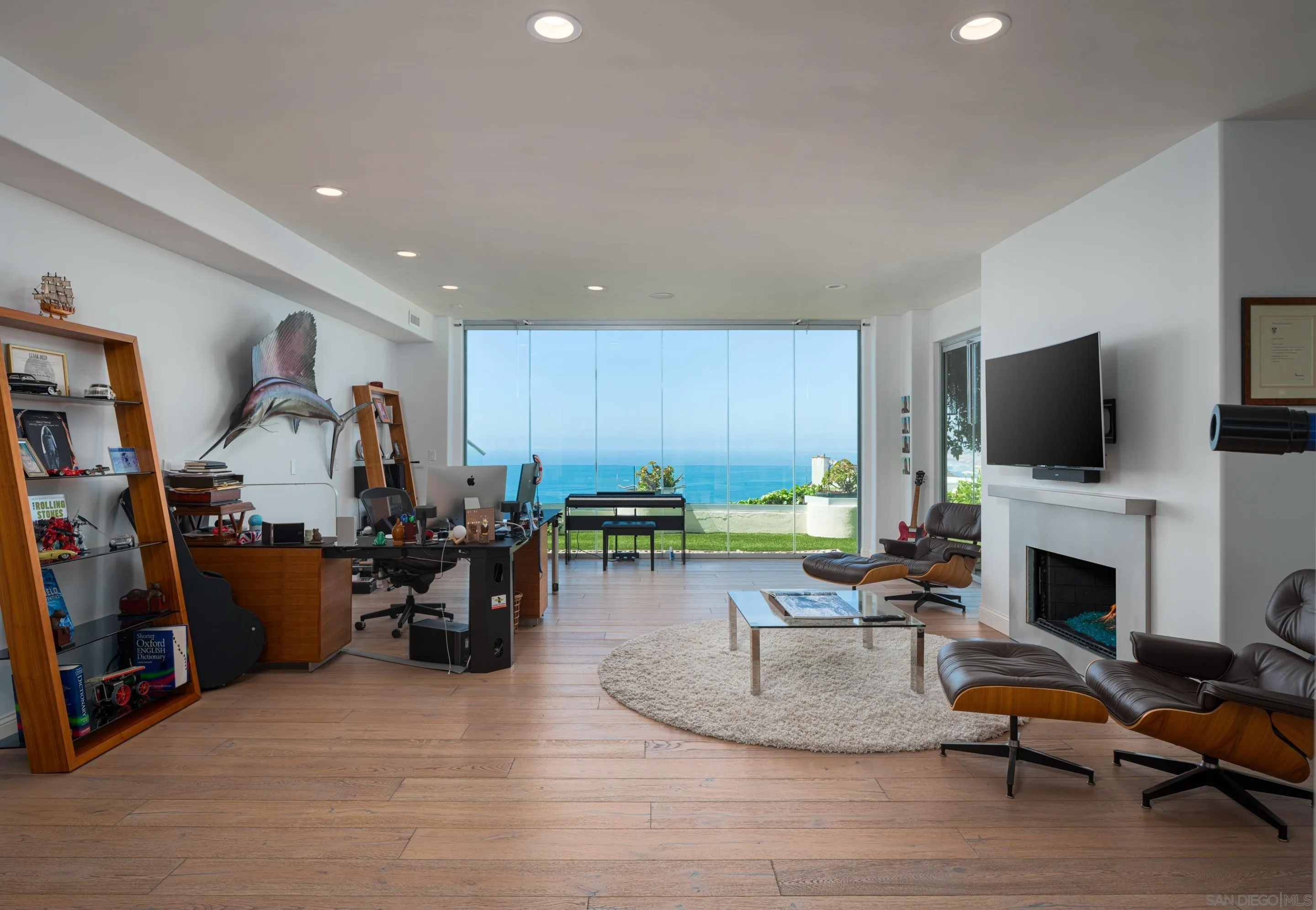 7403 Hillside Drive La Jolla, CA 92037 - Photo 41 of 52 a living room with furniture pool and a flat screen tv