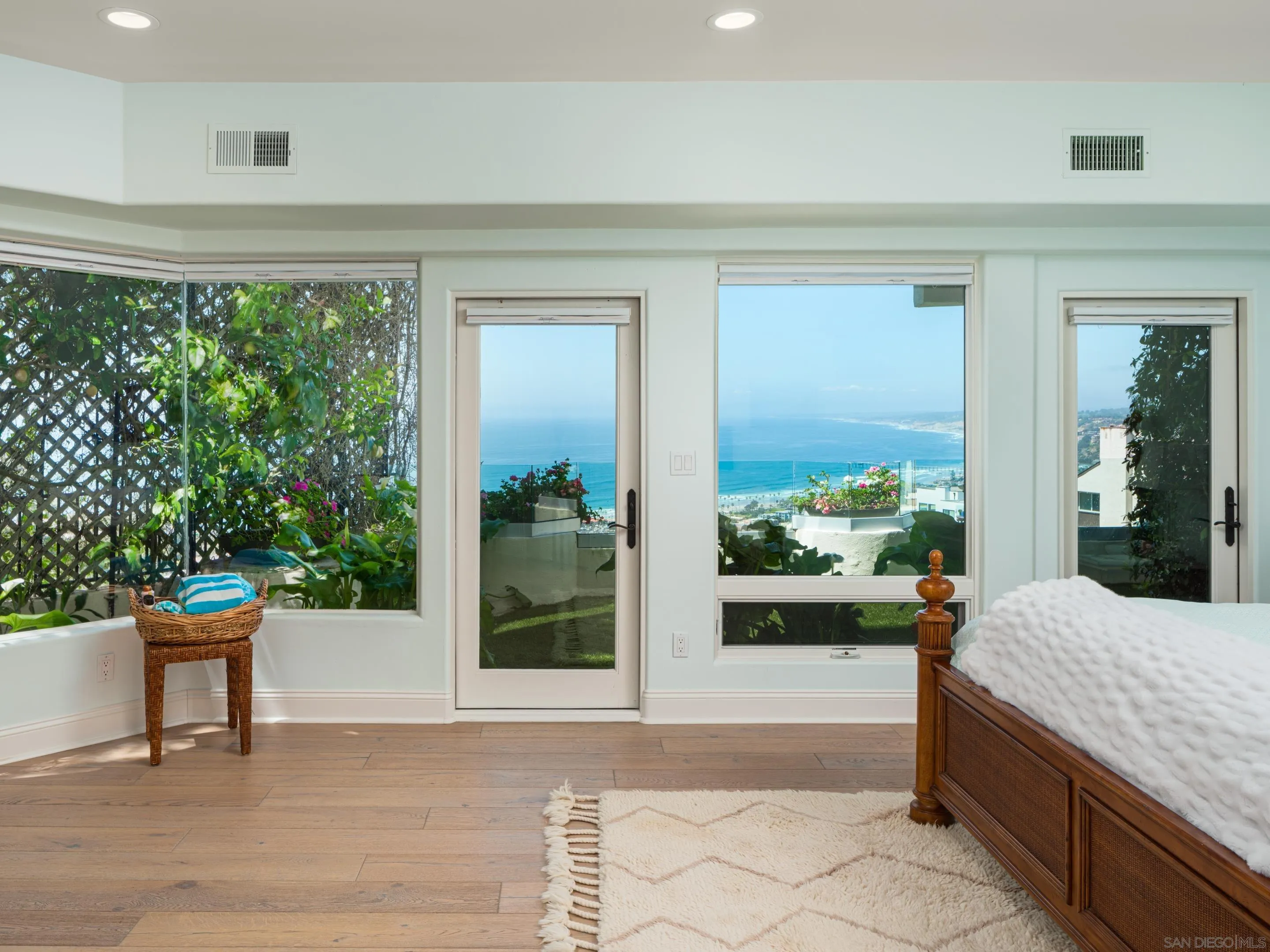 7403 Hillside Drive La Jolla, CA 92037 - Photo 47 of 52 a living room with large windows and furniture