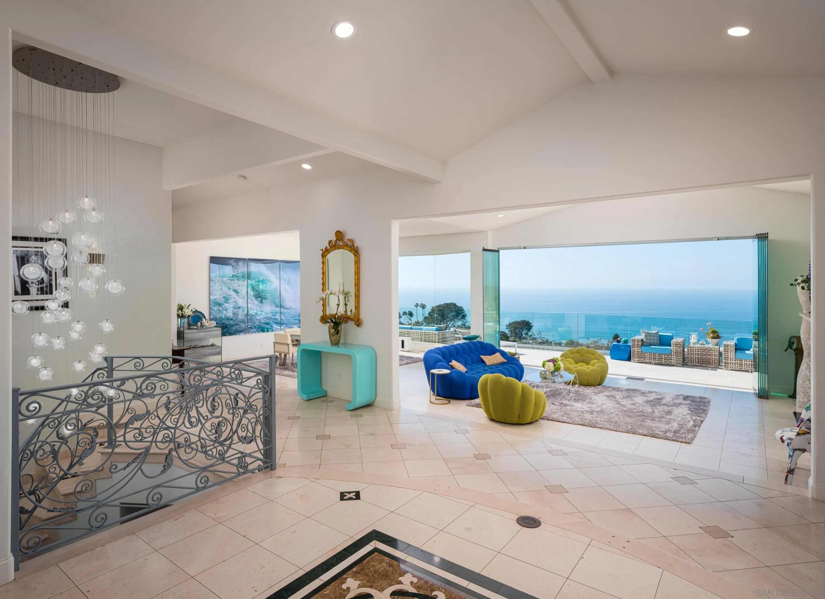 7403 Hillside Drive La Jolla, CA 92037 - Photo 9 of 52 a living room with furniture and a chandelier