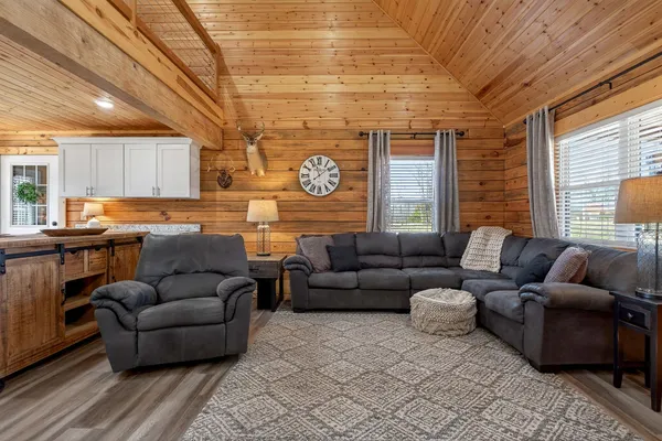 a living room with furniture and a large window