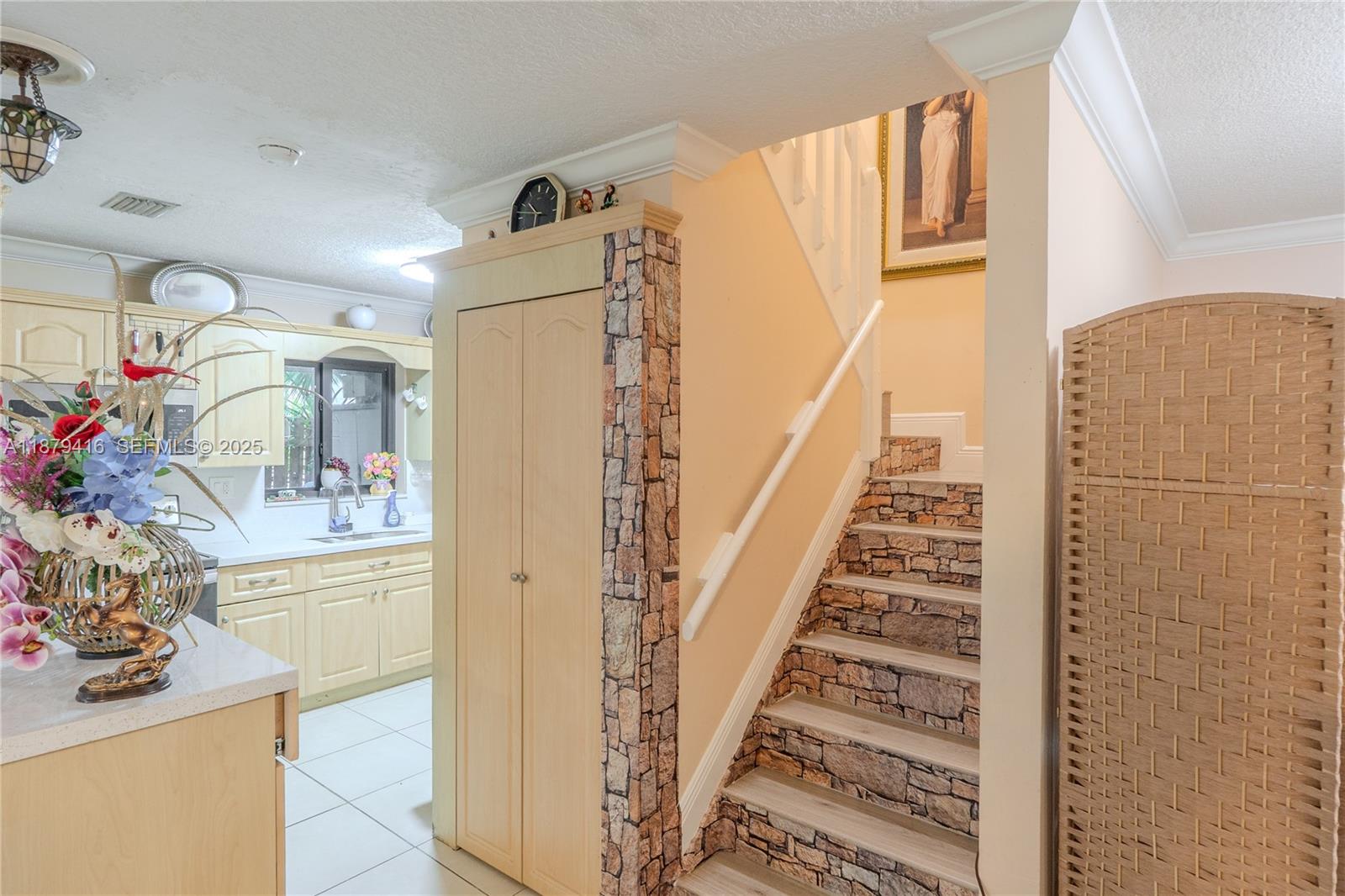 6865 Northwest 169th Street, Unit D Hialeah, FL 33015 - Photo 11 of 21 a view of a bedroom with wooden floor and stairs