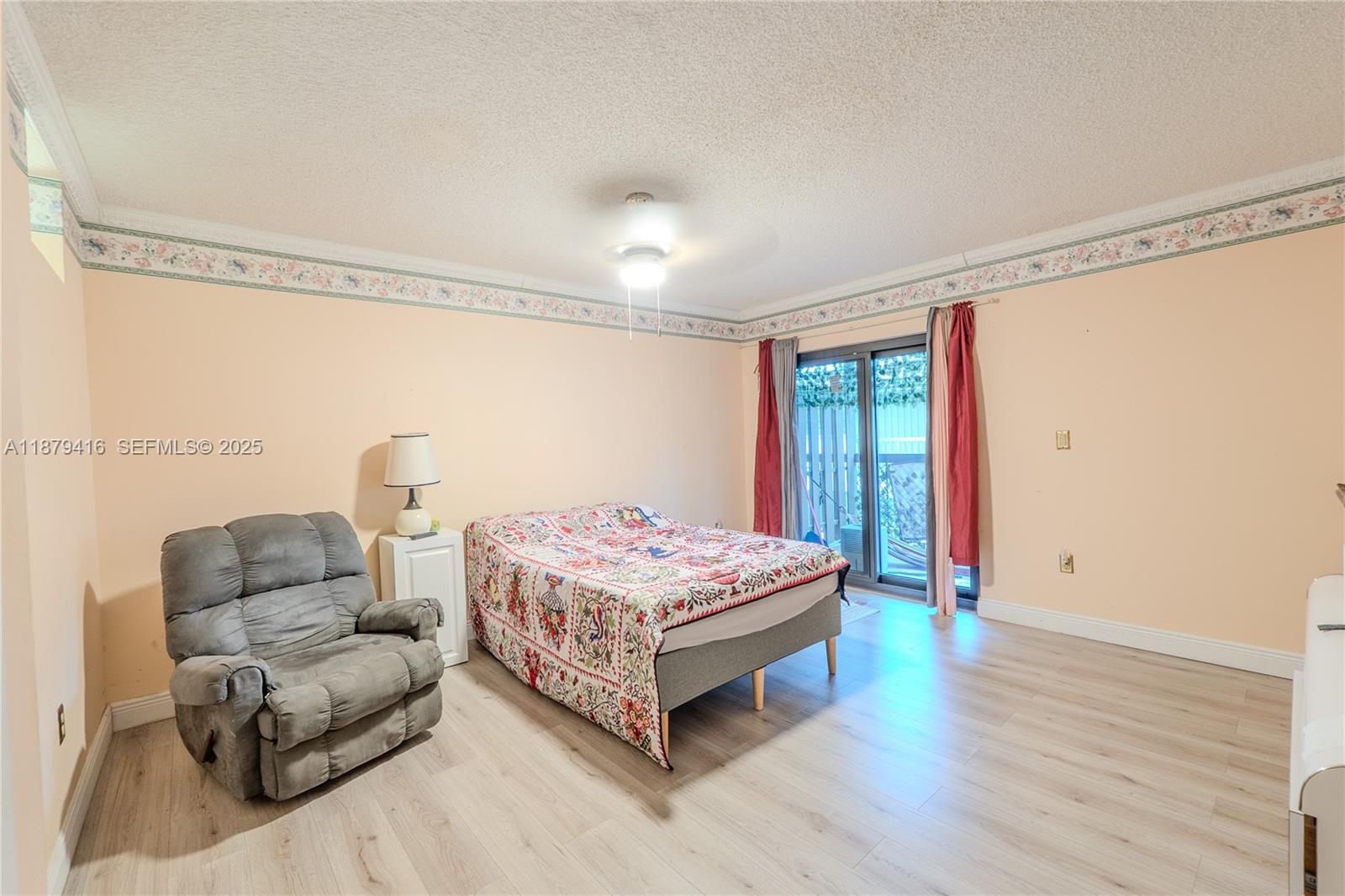 6865 Northwest 169th Street, Unit D Hialeah, FL 33015 - Photo 16 of 21 a living room with furniture and a window