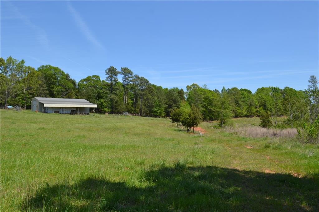 Open acreage with river for rear property line.