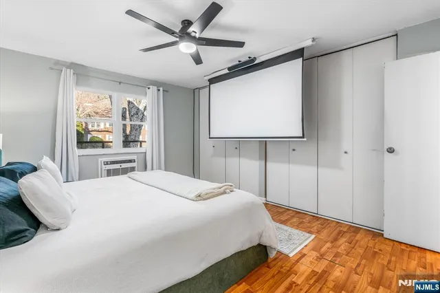 a bathroom with a sink mirror and a shower