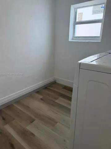 a room with a fan and a window