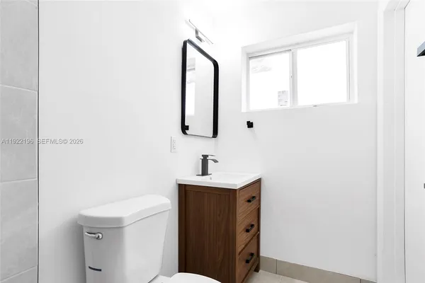 a bathroom with a sink a vanity and a mirror