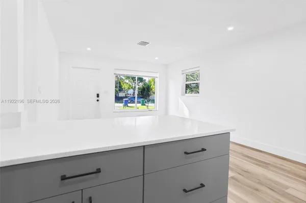 a view with cabinets and window