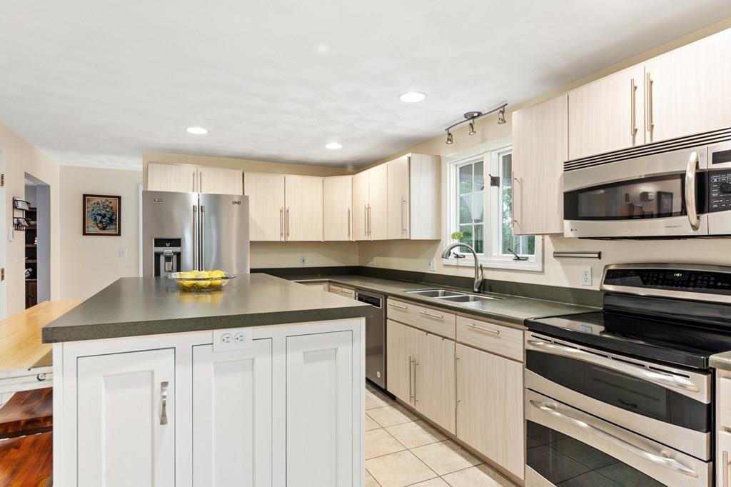 37 Middle Road Newbury, MA 01951 - Photo 13 of 42 a kitchen with stainless steel appliances granite countertop a sink and cabinets