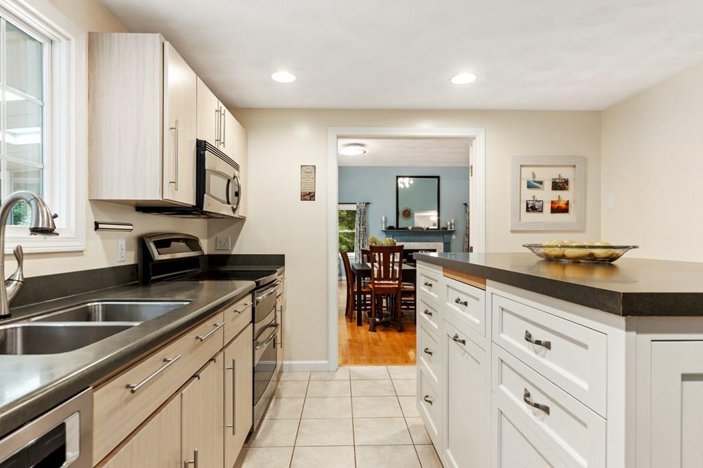 37 Middle Road Newbury, MA 01951 - Photo 15 of 42 a kitchen with stainless steel appliances granite countertop a sink and cabinets