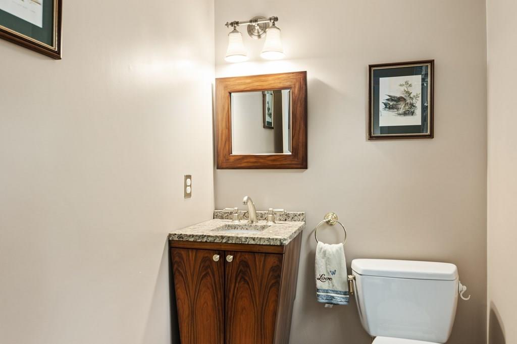 37 Middle Road Newbury, MA 01951 - Photo 17 of 42 a bathroom with a toilet a sink and mirror