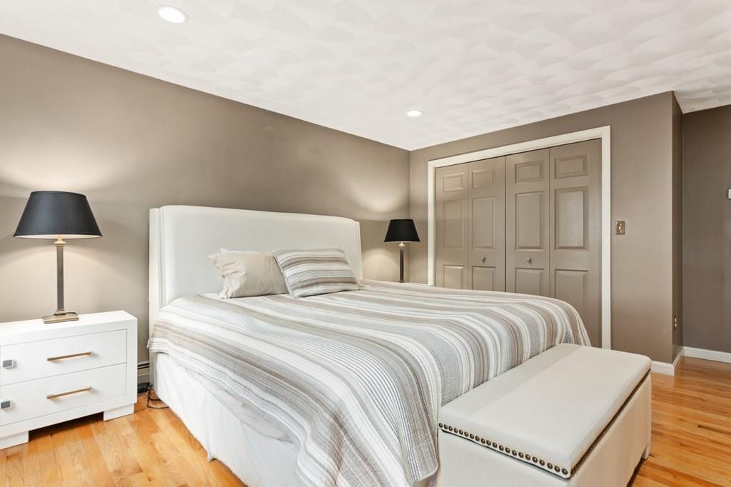 37 Middle Road Newbury, MA 01951 - Photo 19 of 42 a bedroom with a bed and a lamp