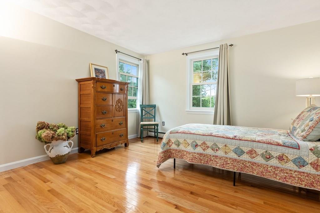 37 Middle Road Newbury, MA 01951 - Photo 23 of 42 a bedroom with a bed and a window